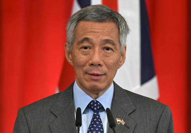 Singapore PM says sorry for family feud