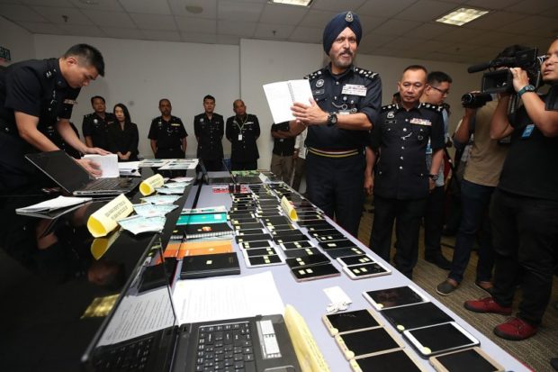 Malaysia, Singapore, HK police team up to arrest 31 linked in love scam