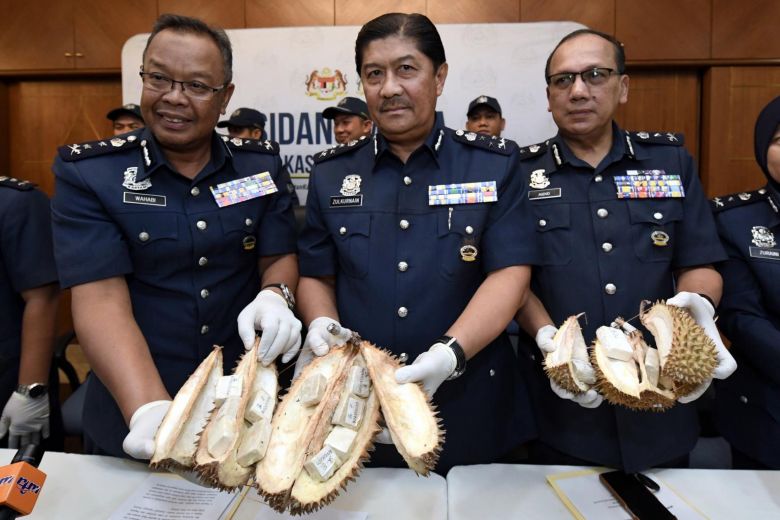 Woman caught in Malaysia trying to smuggle heroin in durians