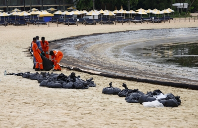 Singapore intensifies oil spill clean-up after it spreads along coast