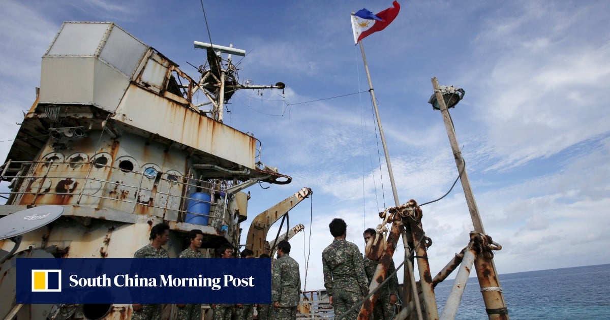 Chinese state media says Philippine troops pointed guns at coastguards near disputed South China Sea reef