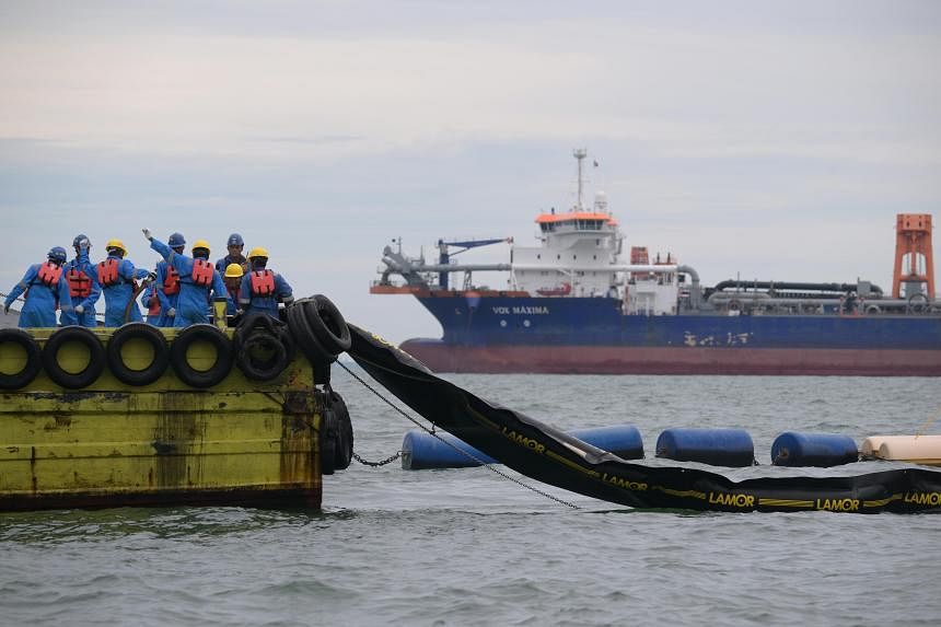 S’pore oil spill: Poor weather delayed laying of booms around damaged ship, says contractor