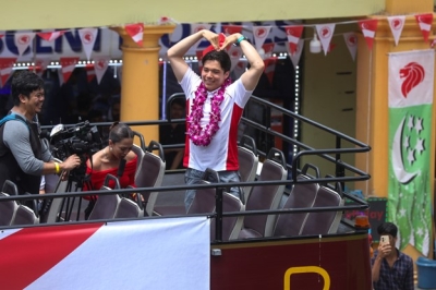 Singapore’s rainy day parade: Thousands brave wet weather to celebrate Olympians, bronze medal