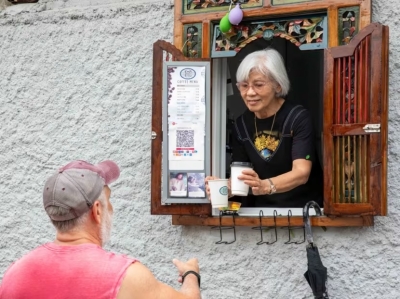 Meet Paulin Khoo, the 73-year-old grandmother who serves up coffee, chats from her kitchen window in Joo Chiat