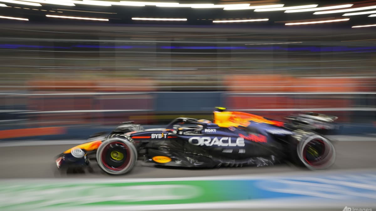 Norris puts McLaren on top in Singapore, Russell crashes