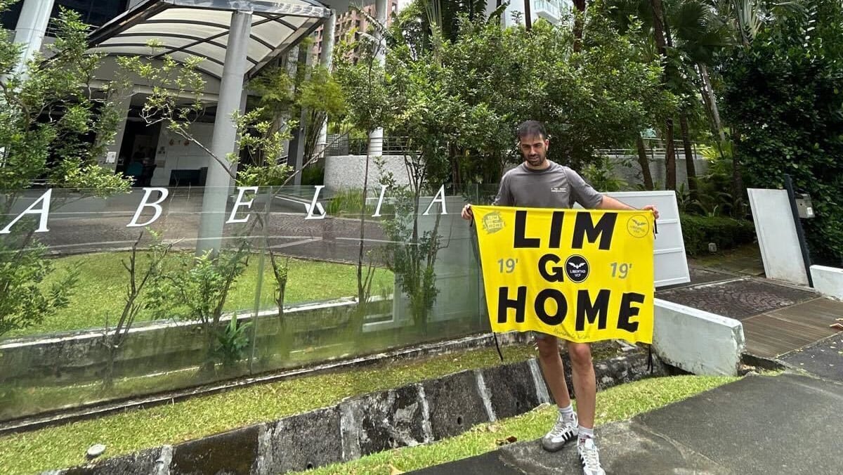 Singapore police investigating Spanish couple over protest against Valencia owner Peter Lim