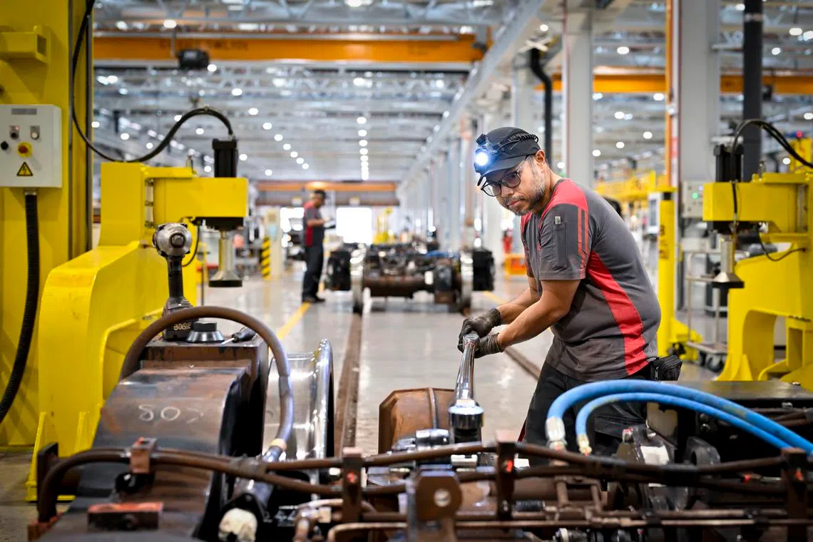 Workers supported by robots in Singapore’s oldest MRT depot