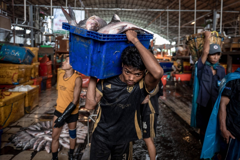 Inside Yangon’s fish markets, survival amid Myanmar’s five-year civil war