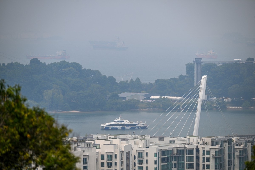 Singapore haze eases after unhealthy readings, but smoke threat lingers