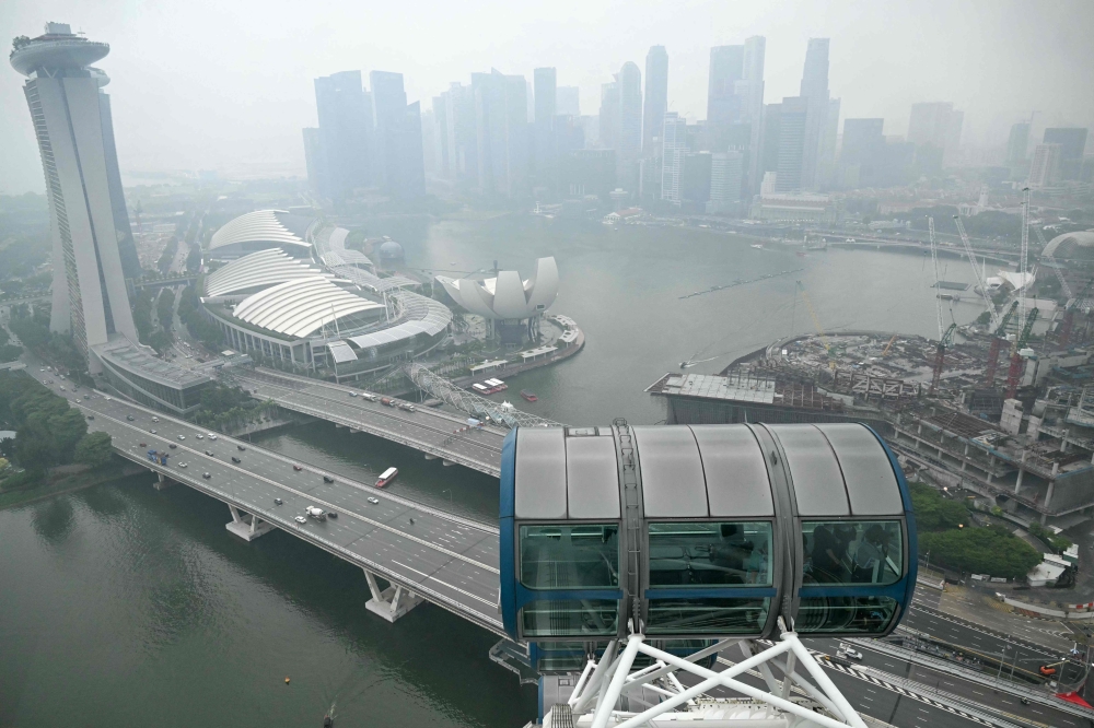 Afternoon showers bring brief haze relief to Singapore, but air quality remains unhealthy