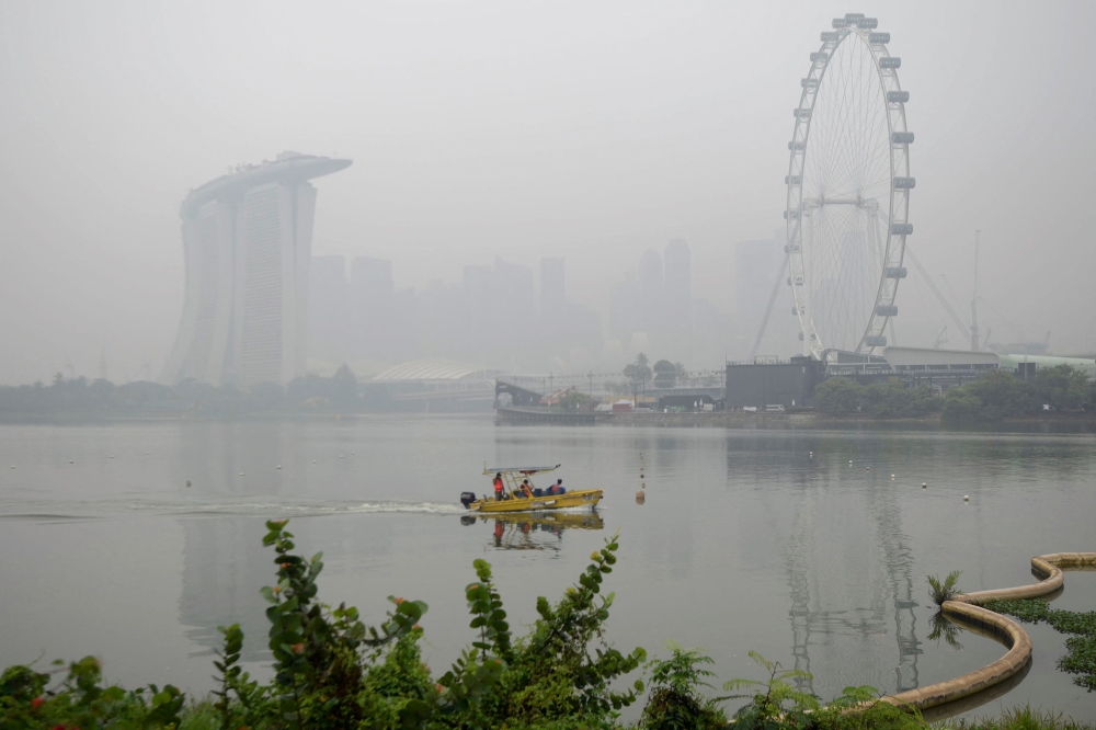 Singapore keeps options open on action against firms over haze as PSI hits 203