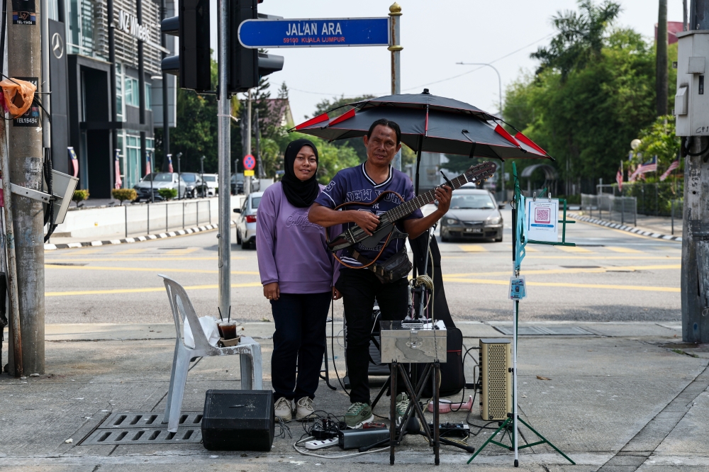 Malaysia’s visually impaired buskers want one thing: A fairer shot at making music pay